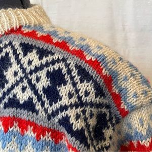 Vintage hand-knit cardigan sweater in red, blue & white pattern. Size 8 (ish)
